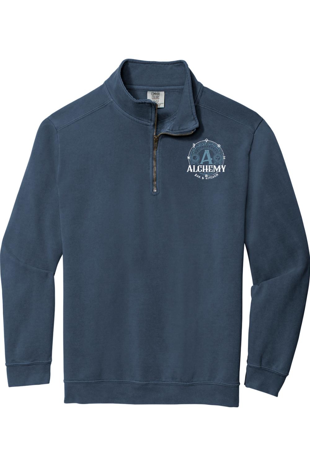 Navy blue Comfort Colors quarter-zip sweatshirt featuring an Alchemy Bar & Kitchen logo on the left chest.