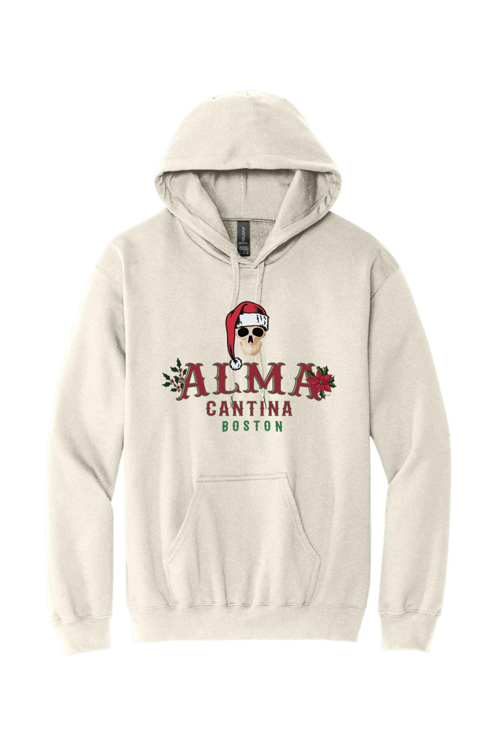 Beige cotton hoodie featuring a graphic of a skull in a Santa hat with Alma Cantina Boston holiday branding.