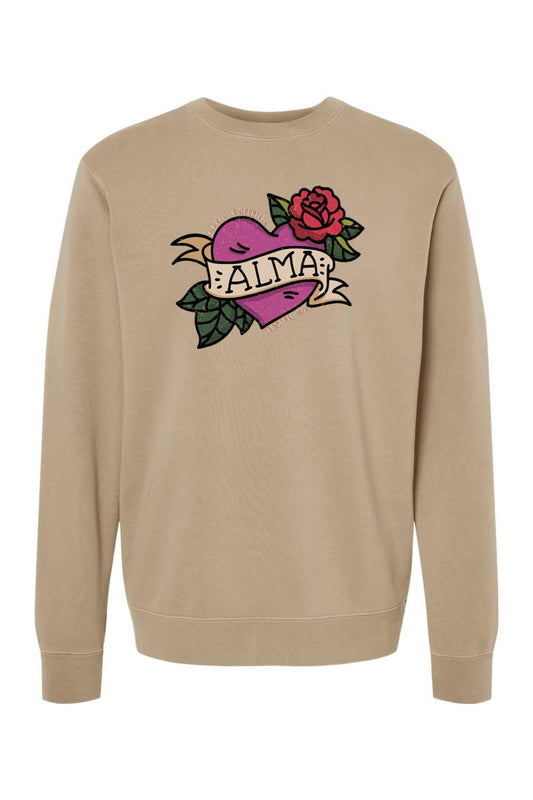 Tan pigment-dyed crewneck sweatshirt featuring a purple heart, red rose, and Alma Cantina graphic on the chest.