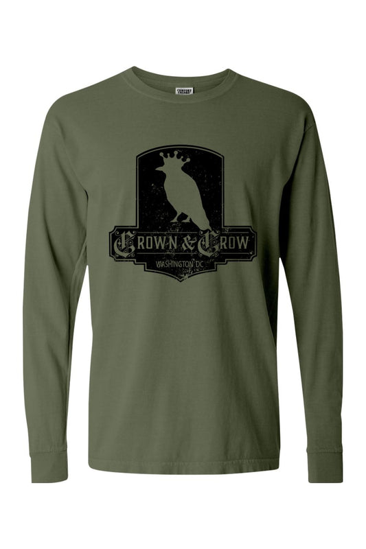Olive green garment-dyed long sleeve t-shirt with a black distressed Crown & Crow graphic on the chest.