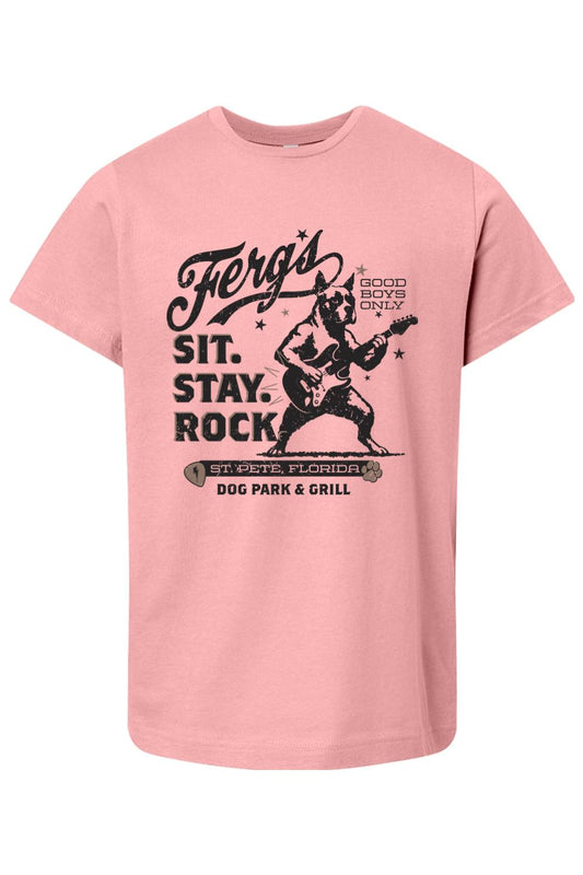 Soft pink cotton kid's t-shirt featuring a black graphic of a dog playing guitar with the text Ferg's Sit. Stay. Rock.
