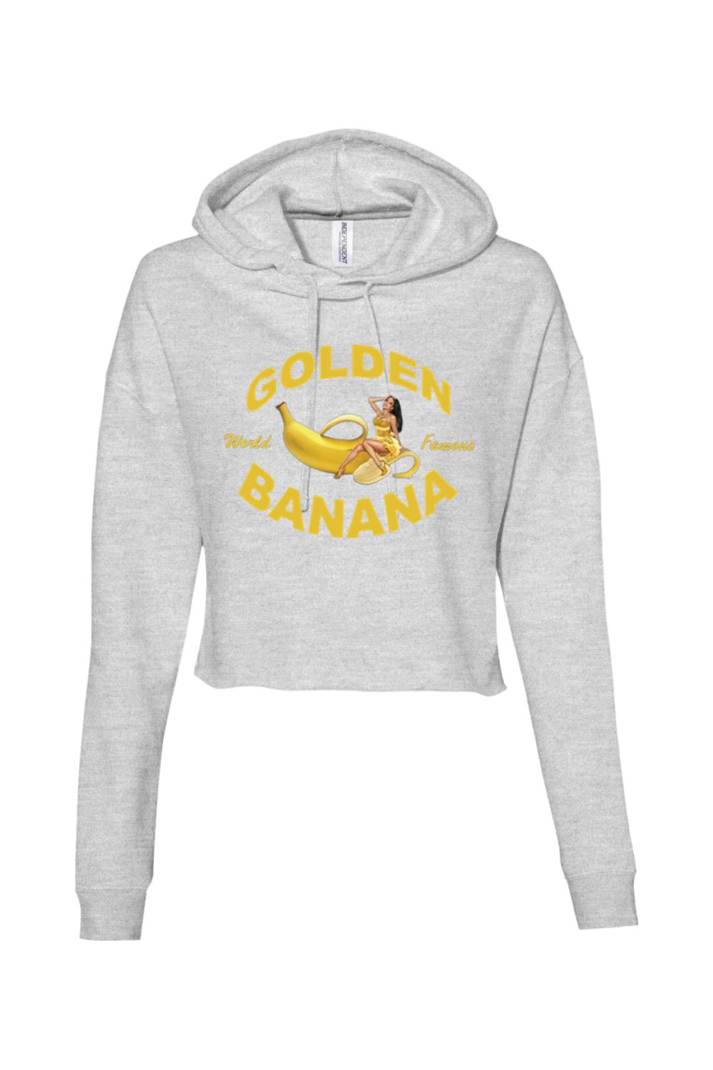 Light grey cropped hooded sweatshirt featuring a yellow Golden Banana graphic with a woman sitting on a banana.