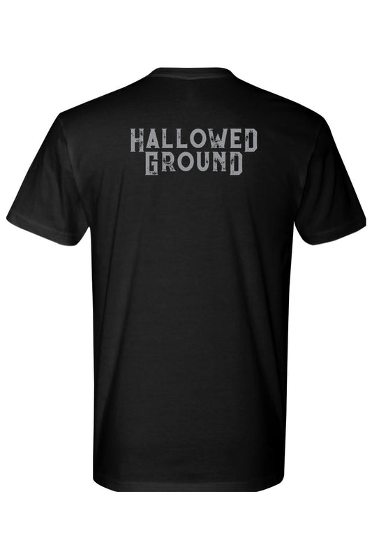 Black 100% cotton t-shirt featuring the Hallowed Ground logo in distressed grey lettering on the back.