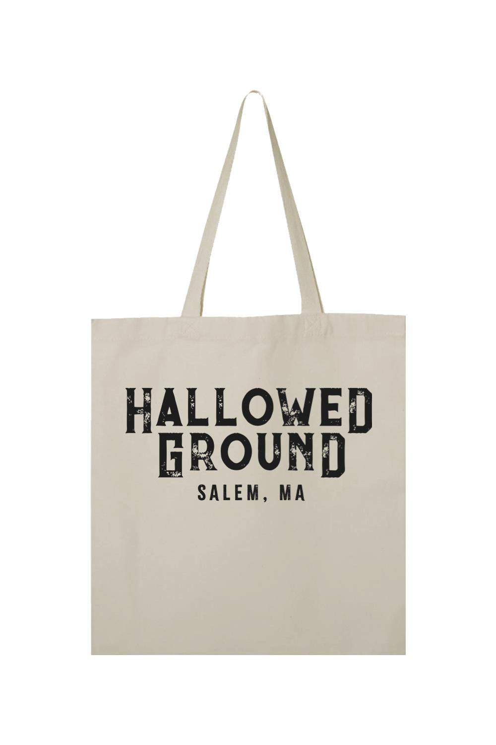 Natural cotton canvas tote bag featuring black Hallowed Ground Salem, MA text in a distressed, vintage-style font.
