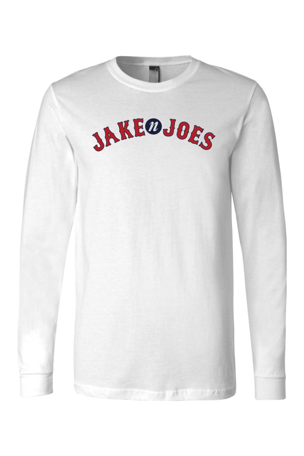 White long-sleeve cotton crewneck t-shirt featuring a red and blue arched Jake n JOES baseball-style logo.