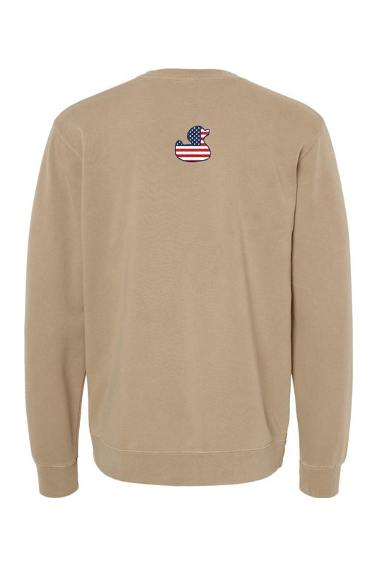 Tan pigment-dyed crewneck sweatshirt featuring a small American flag duck logo on the upper back.
