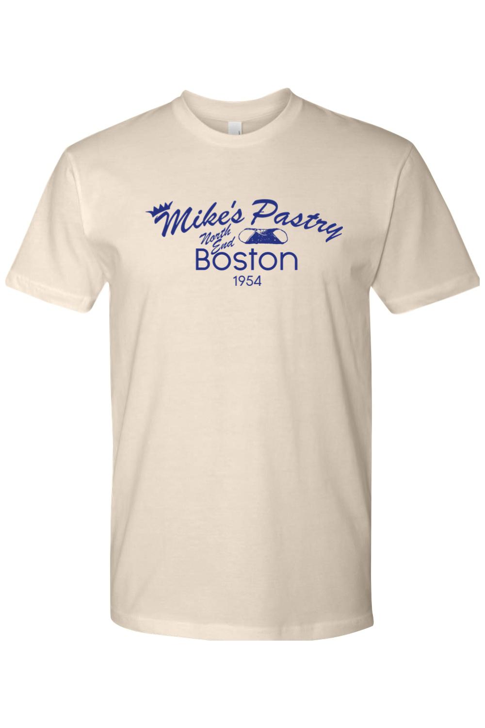 Natural-colored unisex cotton t-shirt featuring a blue retro Mike's Pastry Boston logo on the chest.