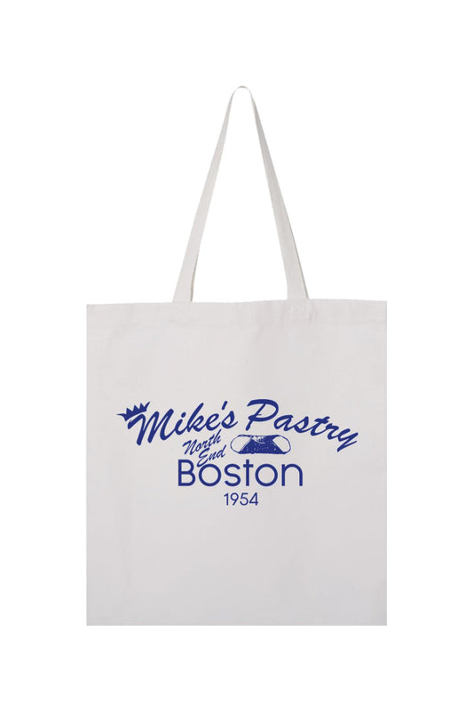 White canvas tote bag featuring a blue Mike's Pastry North End Boston logo with a cannoli graphic.