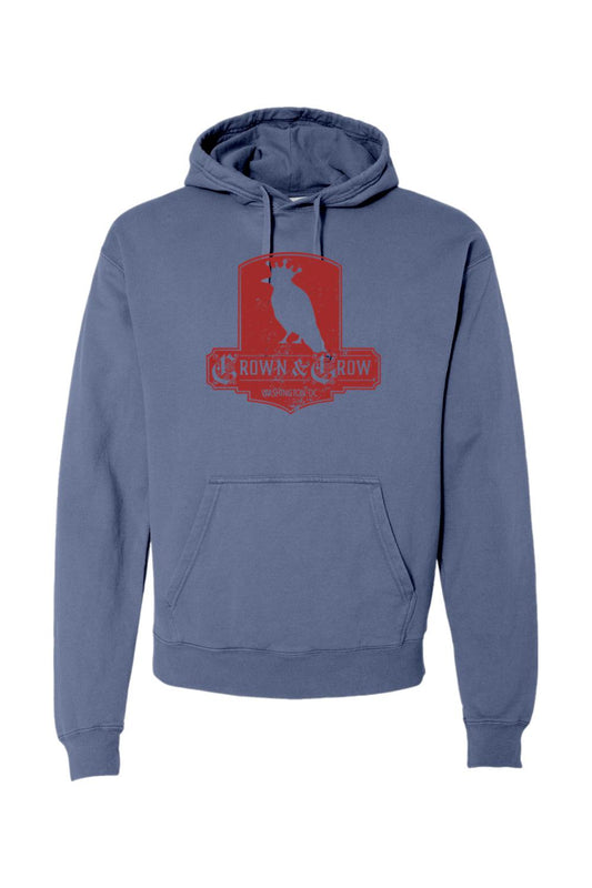 Blue garment-dyed cotton hoodie featuring a red distressed Crown & Crow logo graphic on the chest.