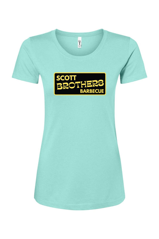 Light blue women's cotton-blend t-shirt featuring a black and gold Scott Brothers Barbecue logo on the chest.