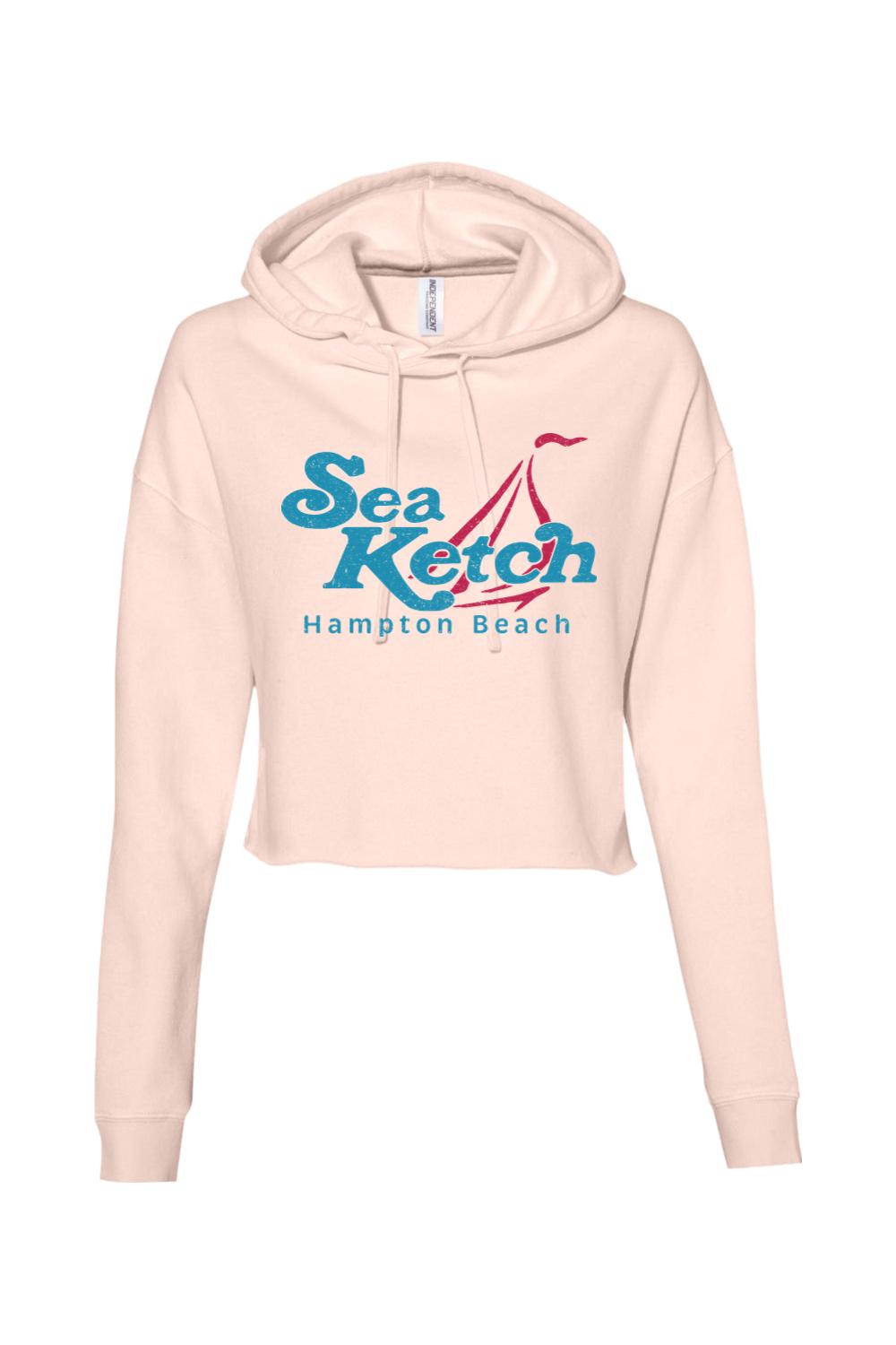 Light pink lightweight cropped hoodie with a blue and red Sea Ketch Hampton Beach sailboat graphic on the front.