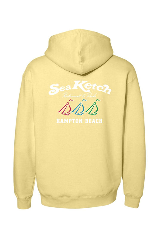 Pale yellow heavyweight hoodie featuring a Sea Ketch Hampton Beach logo with three colorful sailboats on the back.