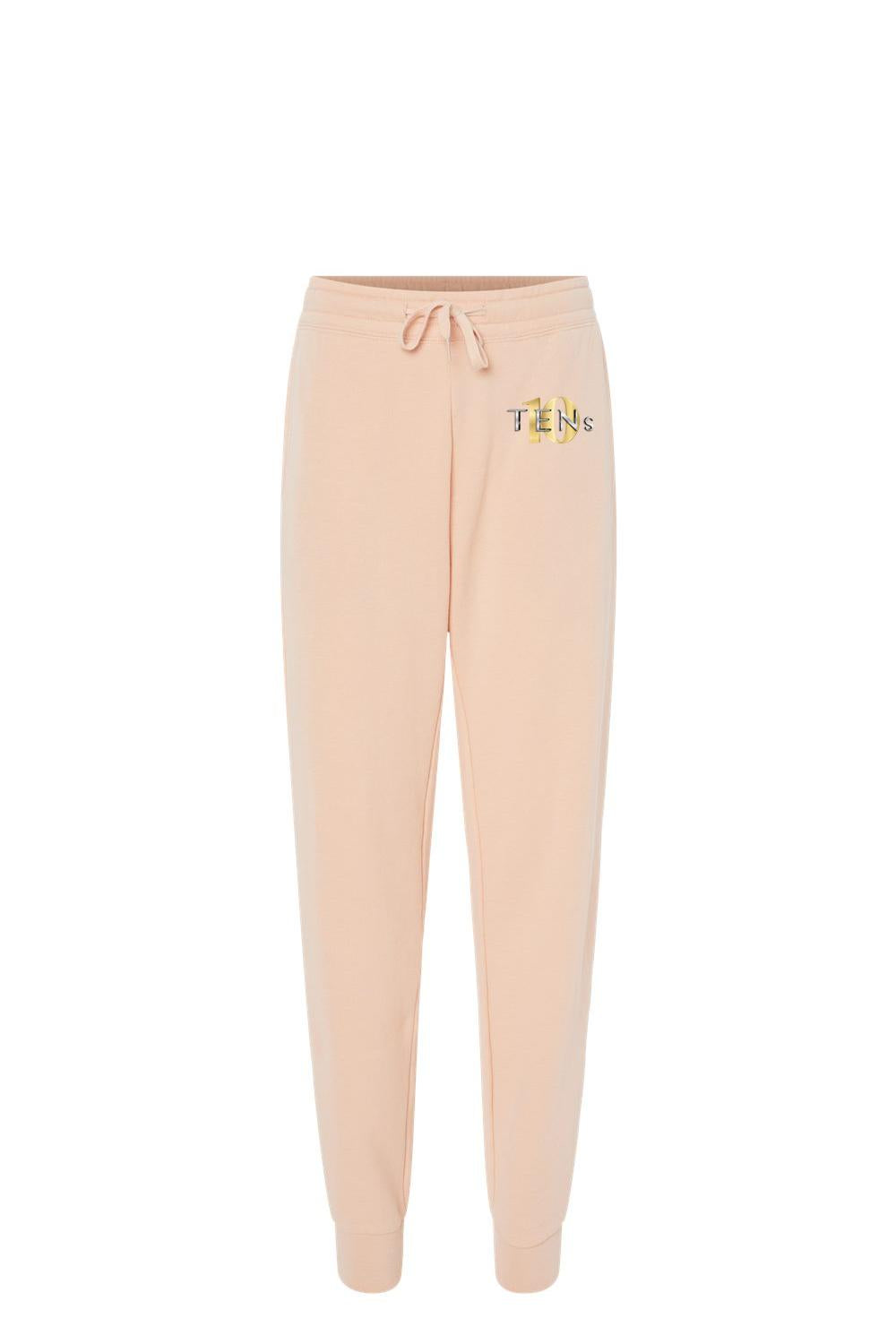 Peach-colored cotton sweatpants with a drawstring waist and gold Tens Show Club logo on the hip.