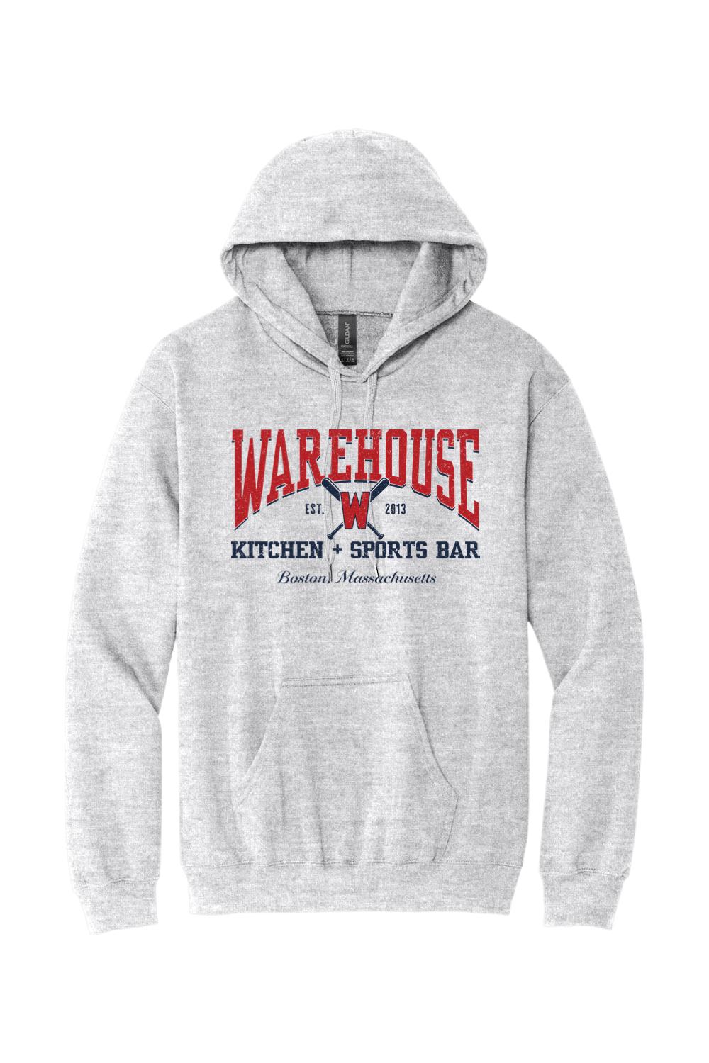 Grey unisex hoodie featuring a red and navy Warehouse Kitchen + Sports Bar baseball graphic on the front.