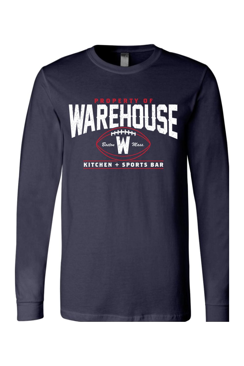 Navy blue long sleeve cotton t-shirt with a white and red Warehouse Kitchen + Sports Bar football graphic.