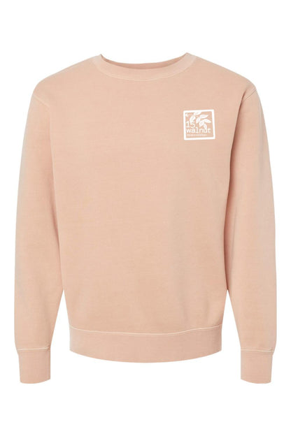 Walnut pigment-dyed crewneck sweatshirt with a white 15 Walnut Tavern + Kitchen logo patch on the chest.