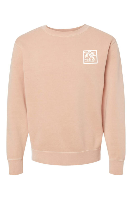 Walnut pigment-dyed crewneck sweatshirt with a white 15 Walnut Tavern + Kitchen logo patch on the chest.
