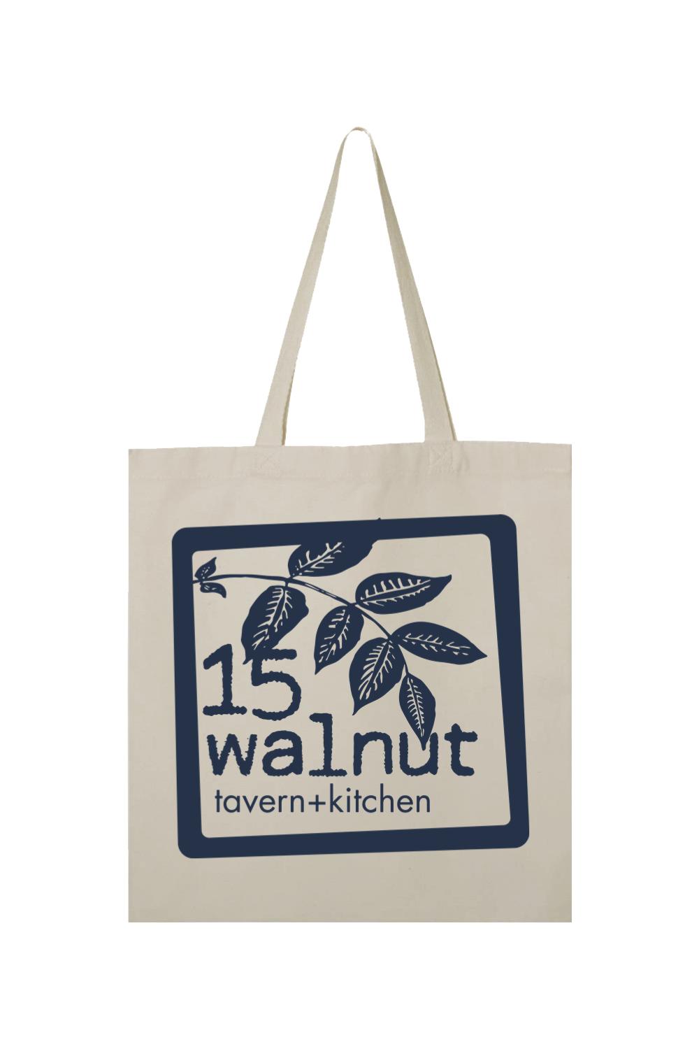 Natural canvas tote bag featuring a navy blue 15 Walnut Tavern + Kitchen logo with a leaf illustration.