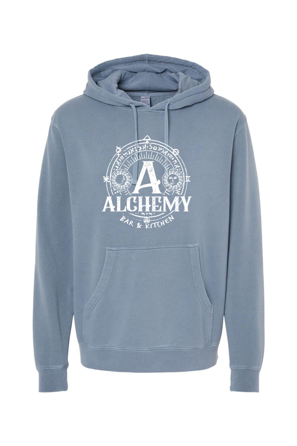 Blue pigment-dyed hoodie featuring a white Alchemy Bar & Kitchen circular graphic with a front kangaroo pocket.