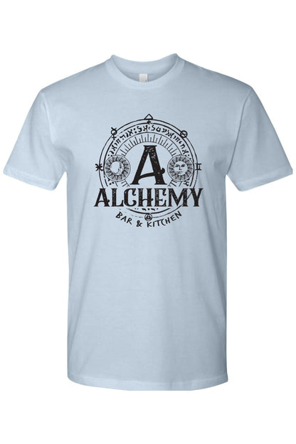 Light blue crew neck t-shirt featuring a black Alchemy Bar & Kitchen circular logo with sun and moon celestial graphics.