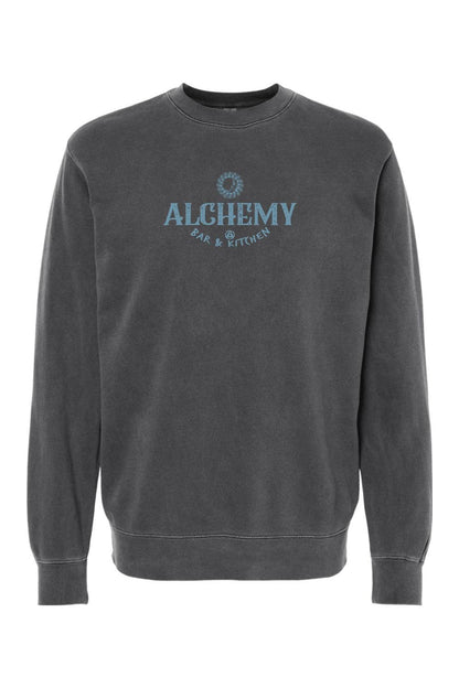 Charcoal grey pigment-dyed crewneck sweatshirt with Alchemy Bar & Kitchen logo in faded blue on the chest.