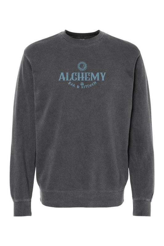Charcoal grey pigment-dyed crewneck sweatshirt with Alchemy Bar & Kitchen logo in faded blue on the chest.