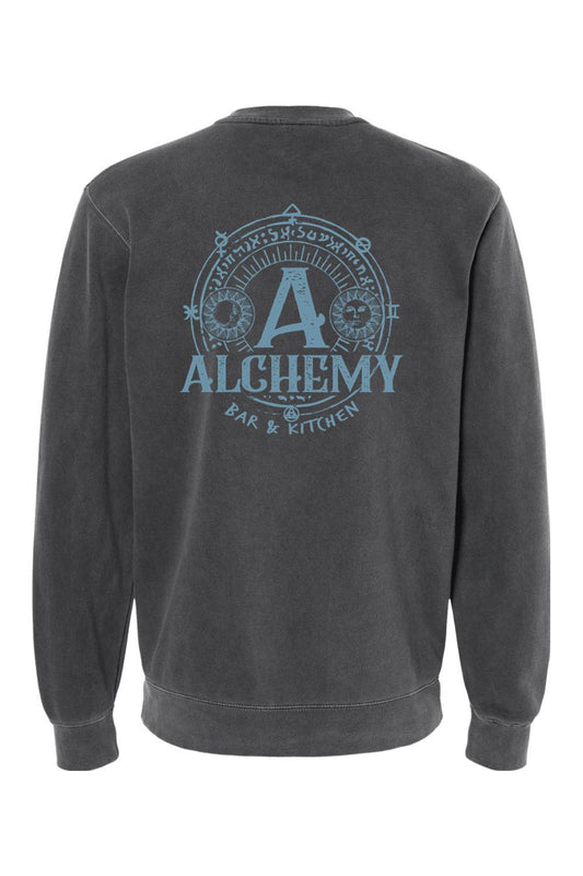 Charcoal pigment-dyed crewneck sweatshirt featuring a blue Alchemy Bar & Kitchen circular graphic on the back.