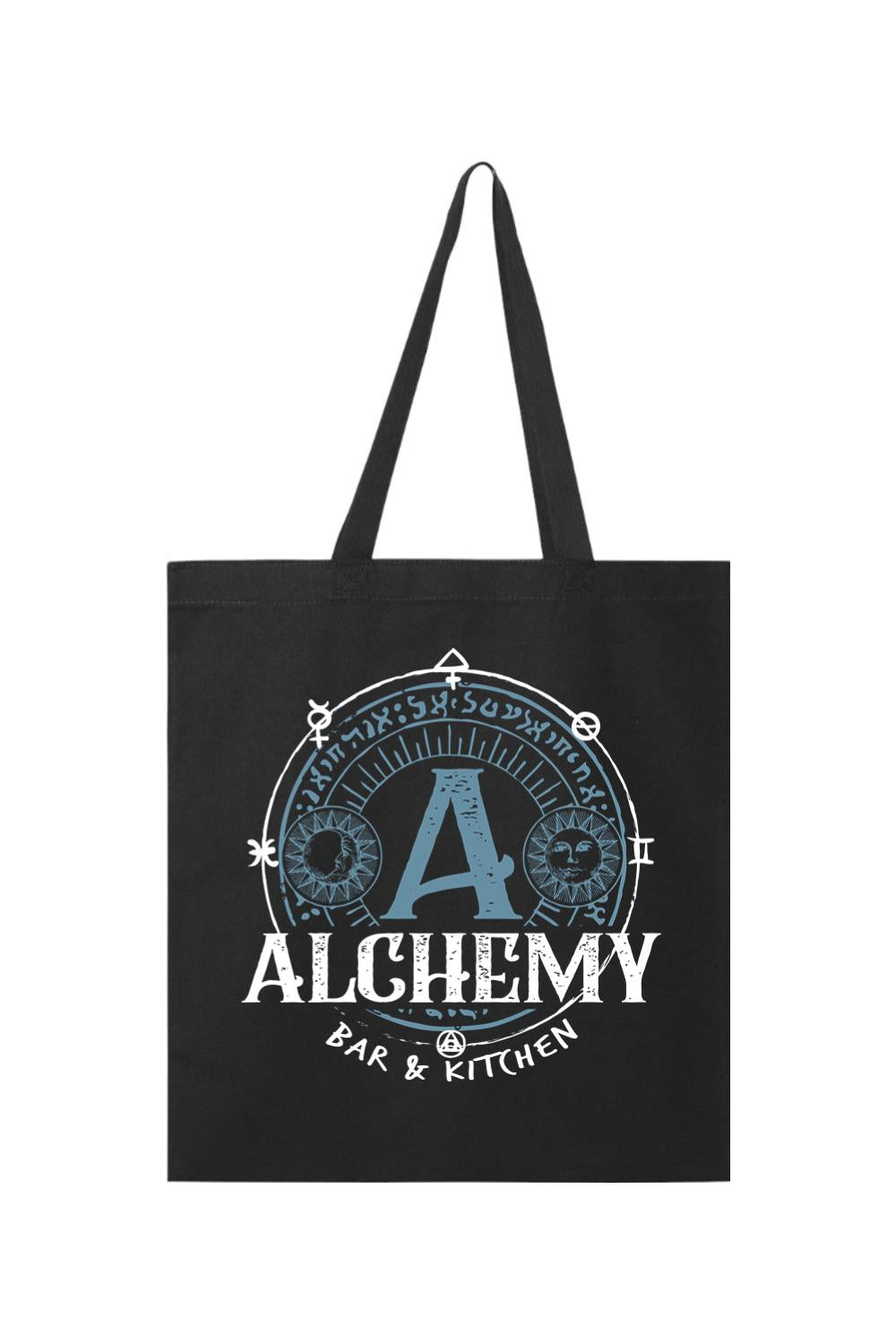 Black canvas tote bag featuring a blue and white Alchemy Bar & Kitchen circular logo with mystical symbols.