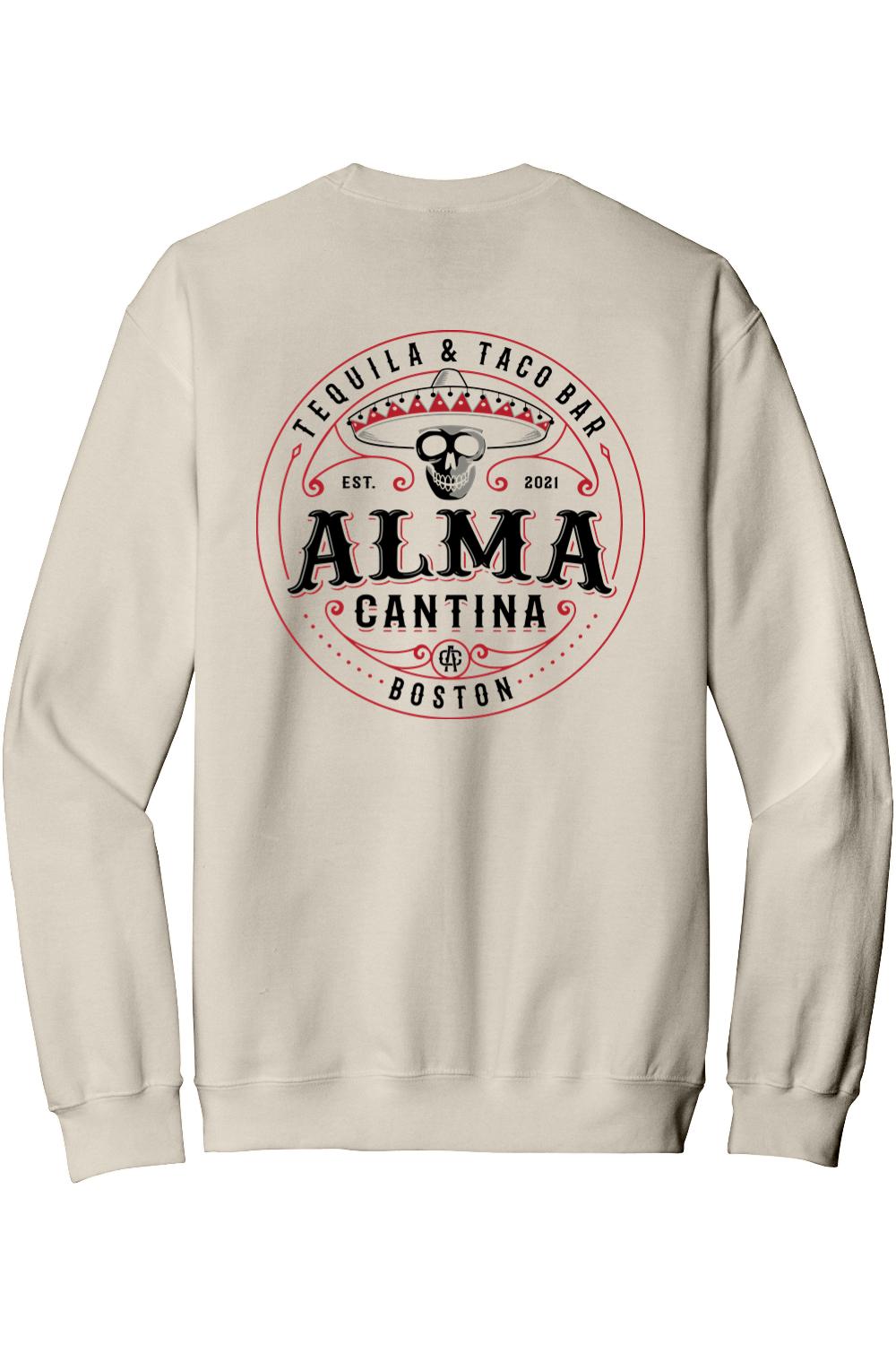 Beige crewneck sweatshirt featuring a red and black Alma Cantina logo with a skull and sombrero on the back.