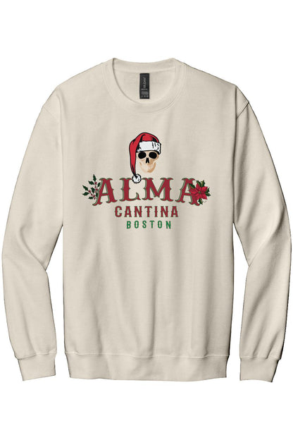Cream-colored cotton crewneck sweatshirt featuring an Alma Cantina holiday skull graphic with a Santa hat and poinsettias.
