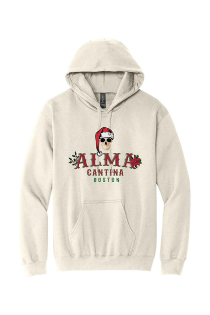 Beige cotton hoodie featuring a graphic of a skull in a Santa hat with Alma Cantina Boston holiday branding.