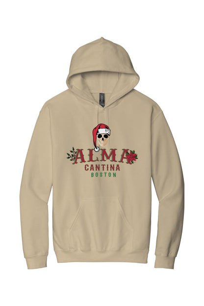 Tan cotton hoodie featuring a Santa-hat-wearing skull graphic and Alma Cantina Boston holiday branding.