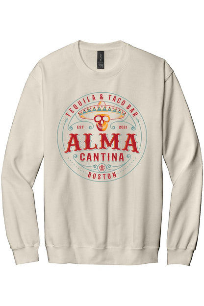 Beige crewneck sweatshirt featuring an Alma Cantina Boston tequila and taco bar logo with a colorful skull graphic.
