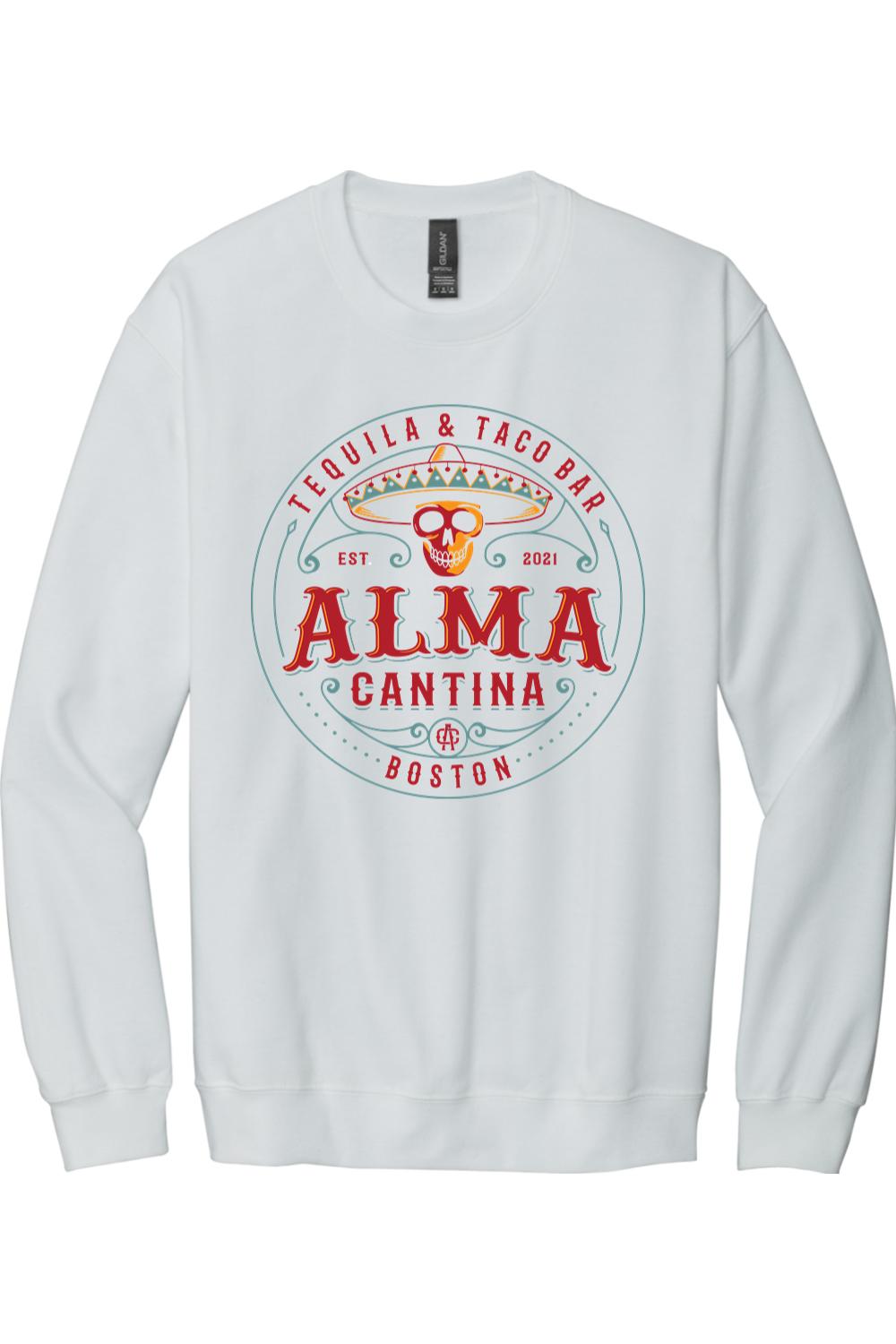 White crewneck sweatshirt featuring a colorful Alma Cantina tequila and taco bar logo with a skull and sombrero.