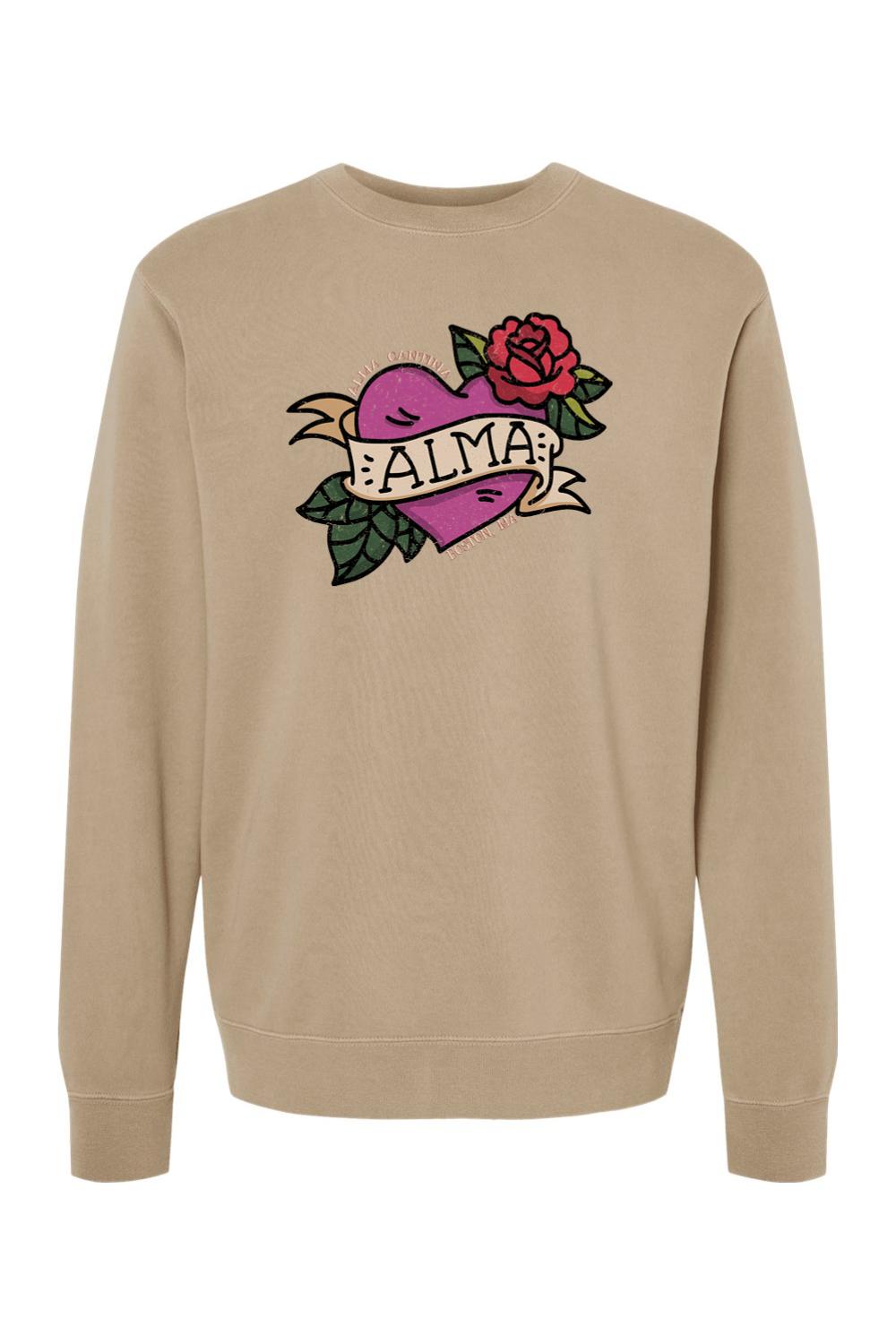 Tan pigment-dyed crewneck sweatshirt featuring a purple heart, red rose, and Alma Cantina graphic on the chest.