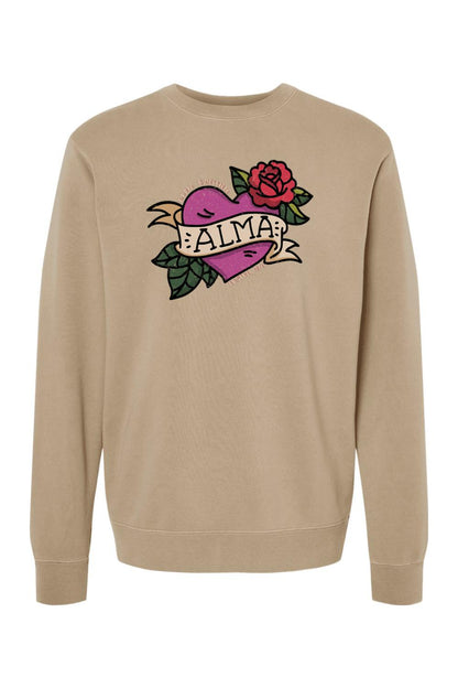 Tan pigment-dyed crewneck sweatshirt featuring a purple heart, red rose, and Alma Cantina graphic on the chest.