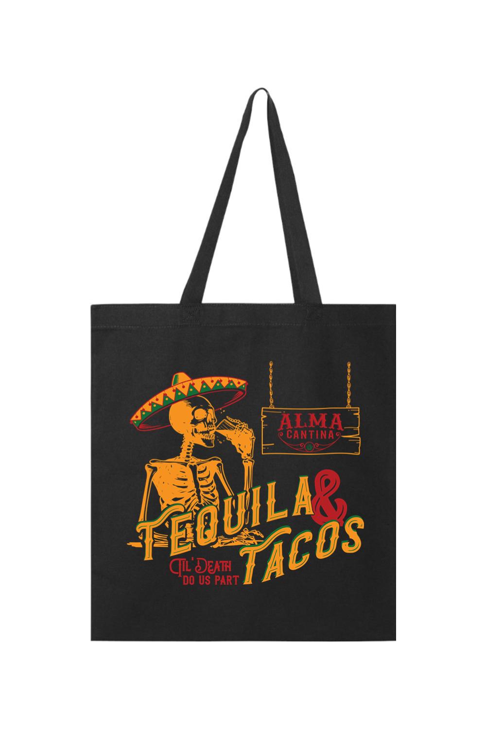 Black canvas tote bag featuring a skeleton wearing a sombrero, drinking tequila, with Alma Cantina branding.
