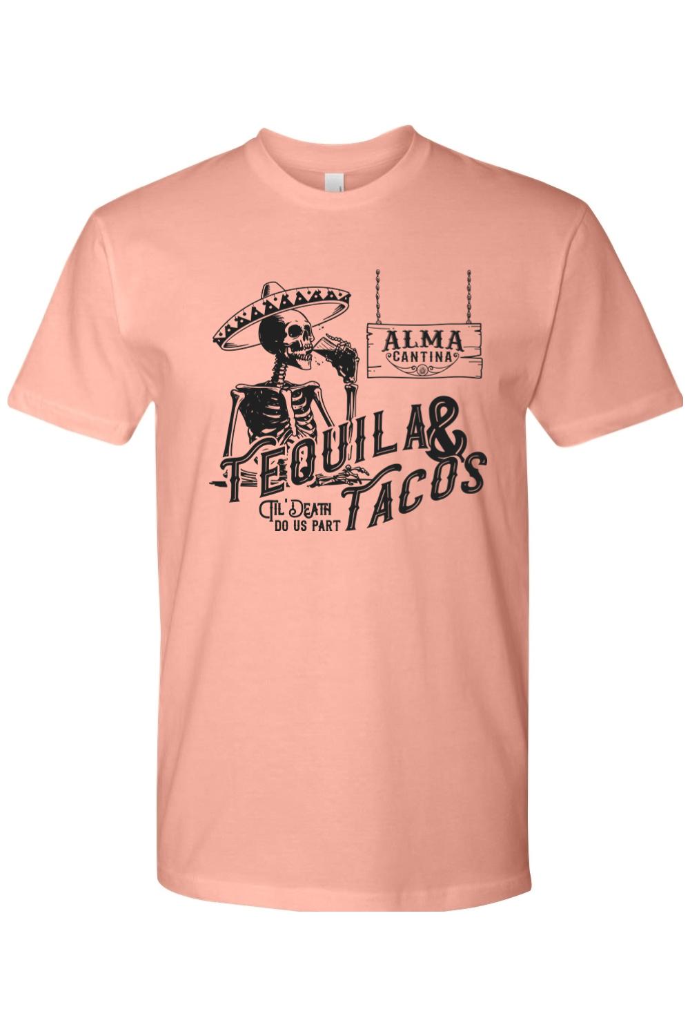 Peach-colored premium cotton t-shirt featuring a black graphic of a skeleton in a sombrero drinking tequila and tacos.