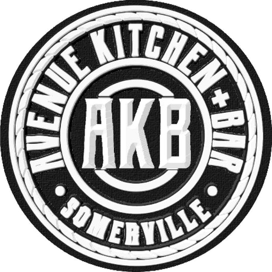 Black and white circular 3D embroidered patch for Avenue Kitchen + Bar featuring AKB text and Somerville branding.