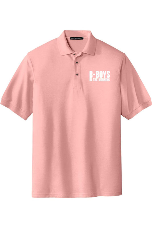 Light pink silk touch polo shirt with a white B-Boys In The Morning chest logo and three-button placket.