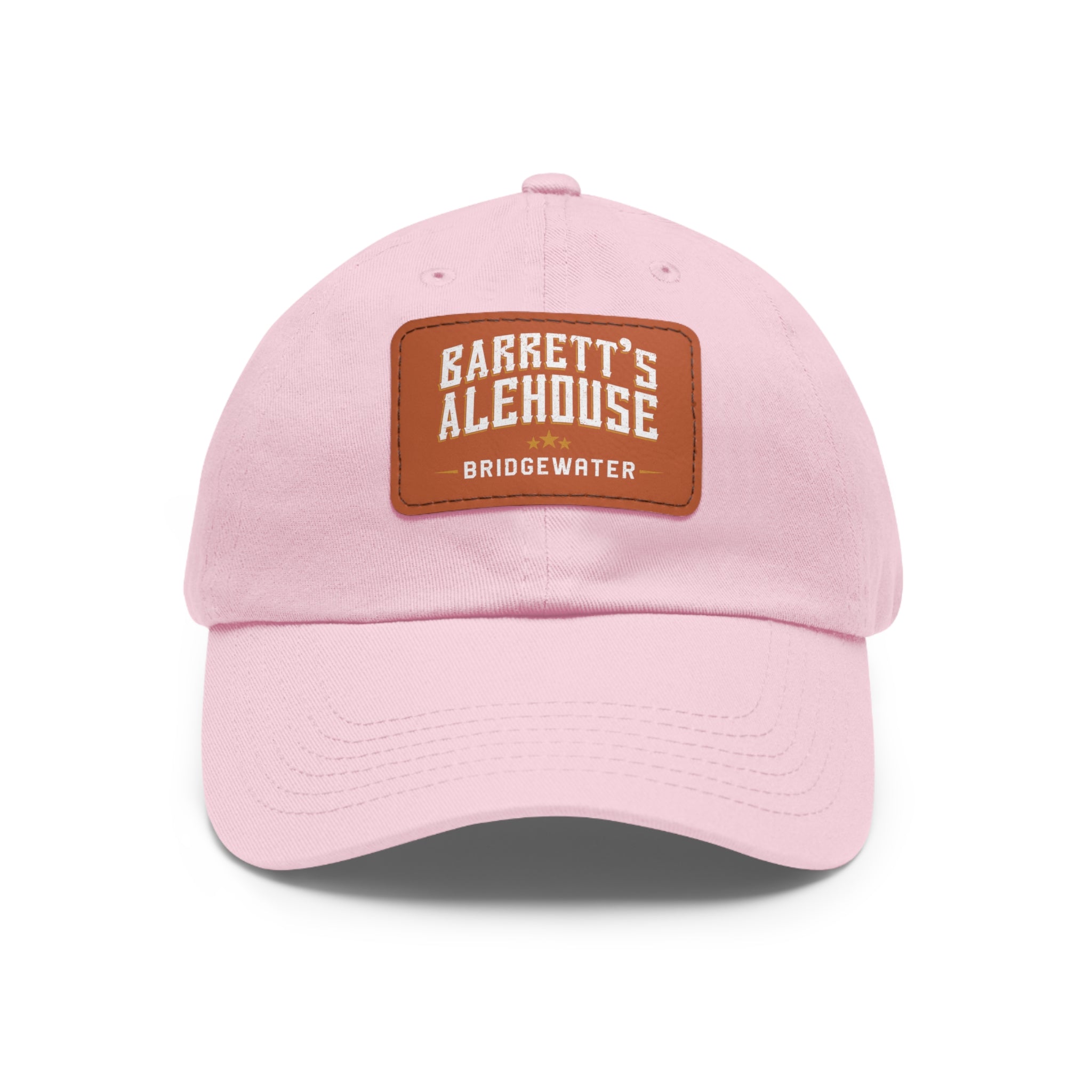 Light pink bio-washed chino twill dad cap with a brown faux leather patch featuring the Barrett's Alehouse logo.
