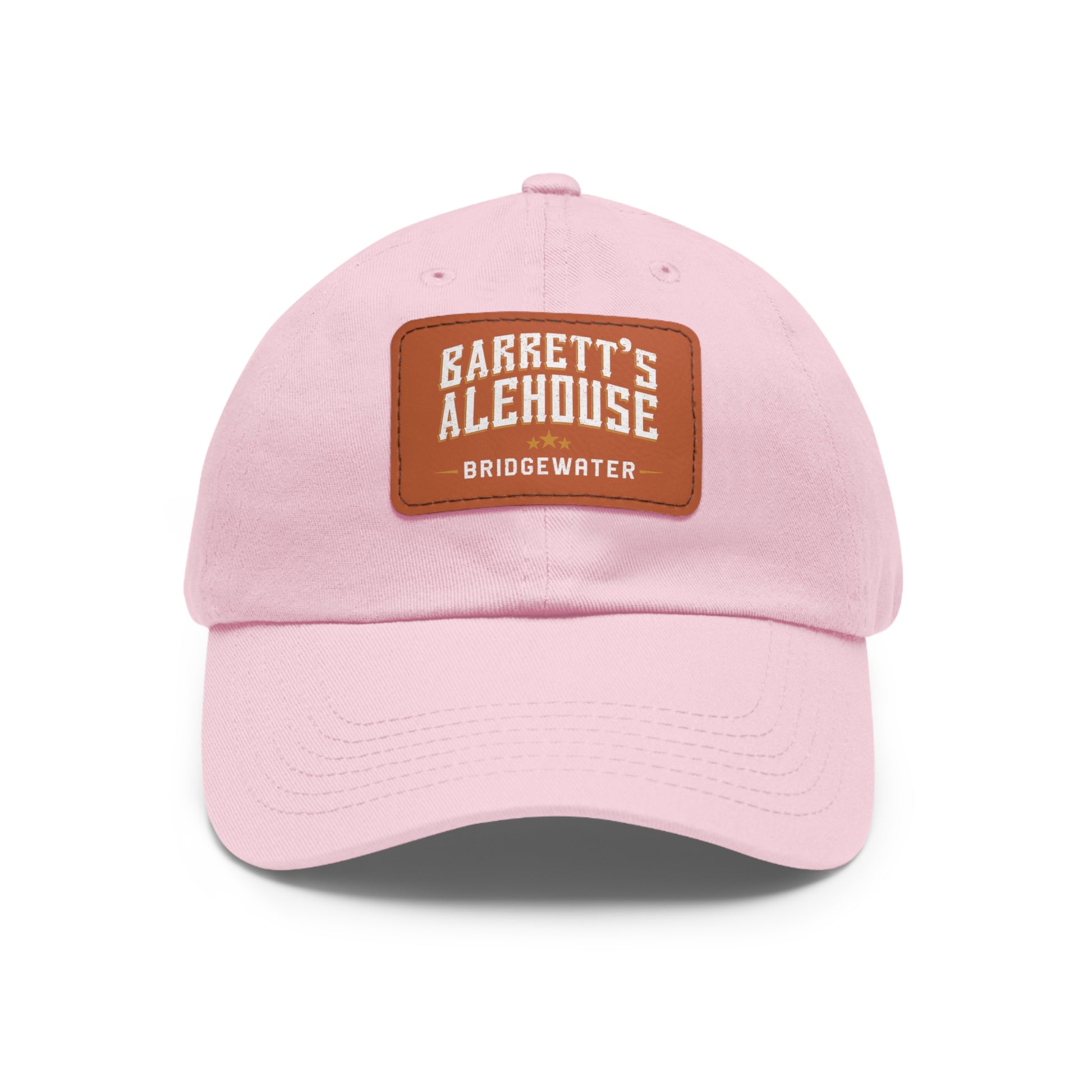 Light pink bio-washed chino twill dad cap with a brown faux leather patch featuring the Barrett's Alehouse logo.