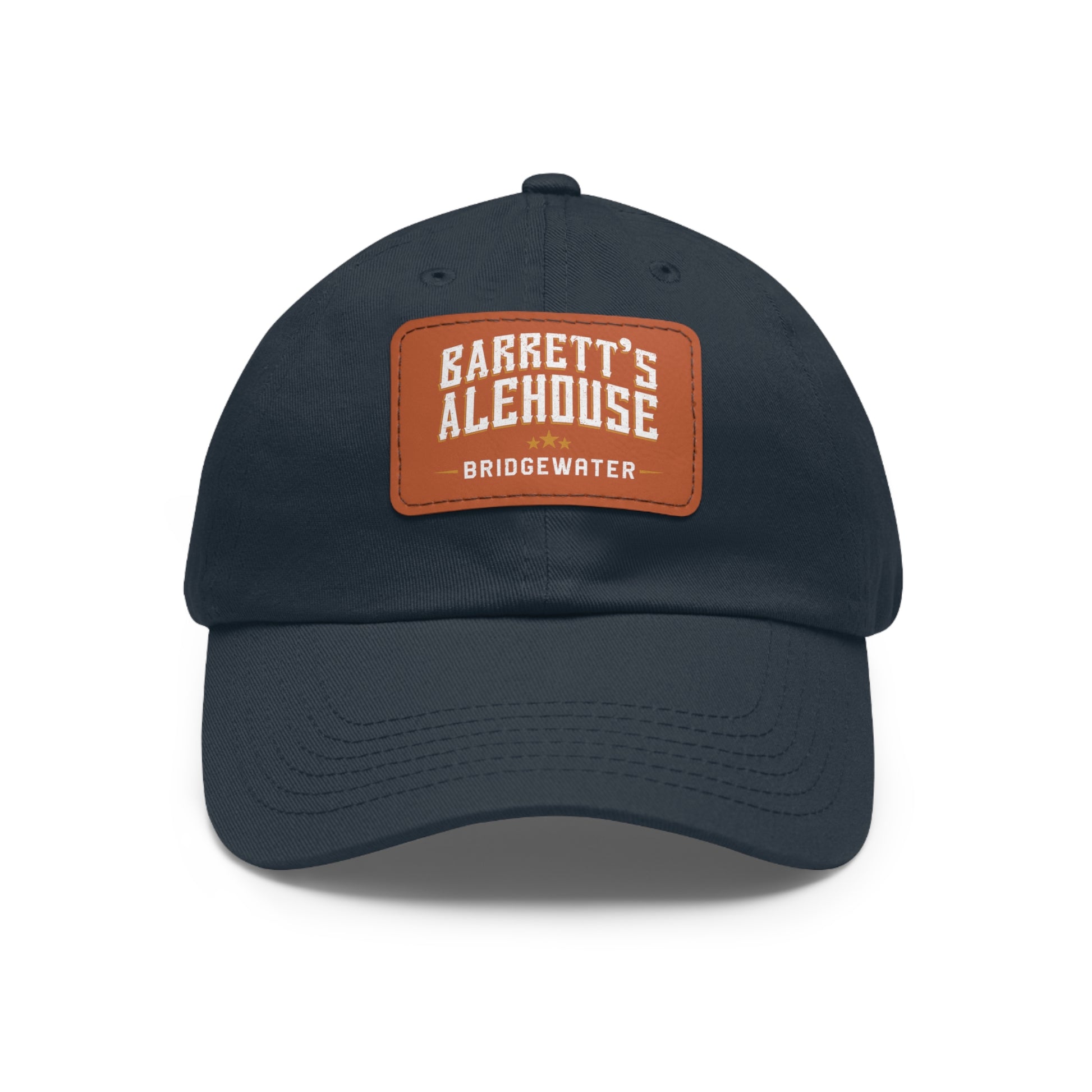 Navy blue unstructured dad cap with a brown faux leather patch featuring Barrett's Alehouse Bridgewater logo.