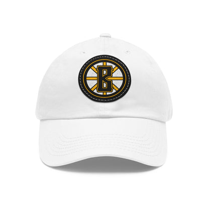 White bio-washed cotton dad hat with a black and yellow leather patch featuring a Barrett's Alehouse B logo.