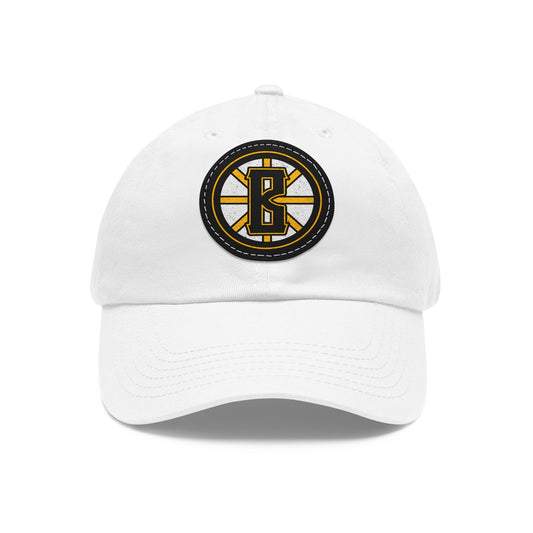 White bio-washed cotton dad hat with a black and yellow leather patch featuring a Barrett's Alehouse B logo.