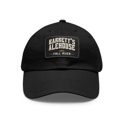 Black unstructured dad hat with a faux leather patch featuring the Barrett's Alehouse Fall River logo.