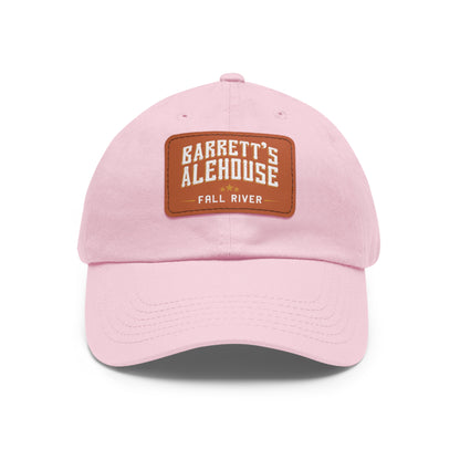 Light pink bio-washed chino twill dad hat with a brown faux leather Barrett's Alehouse Fall River patch.