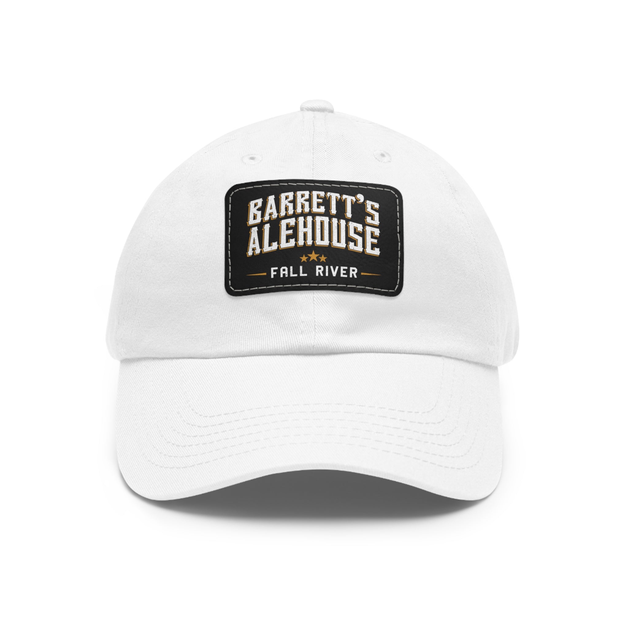 White unstructured dad hat with a black faux leather patch featuring the Barrett's Alehouse Fall River logo.