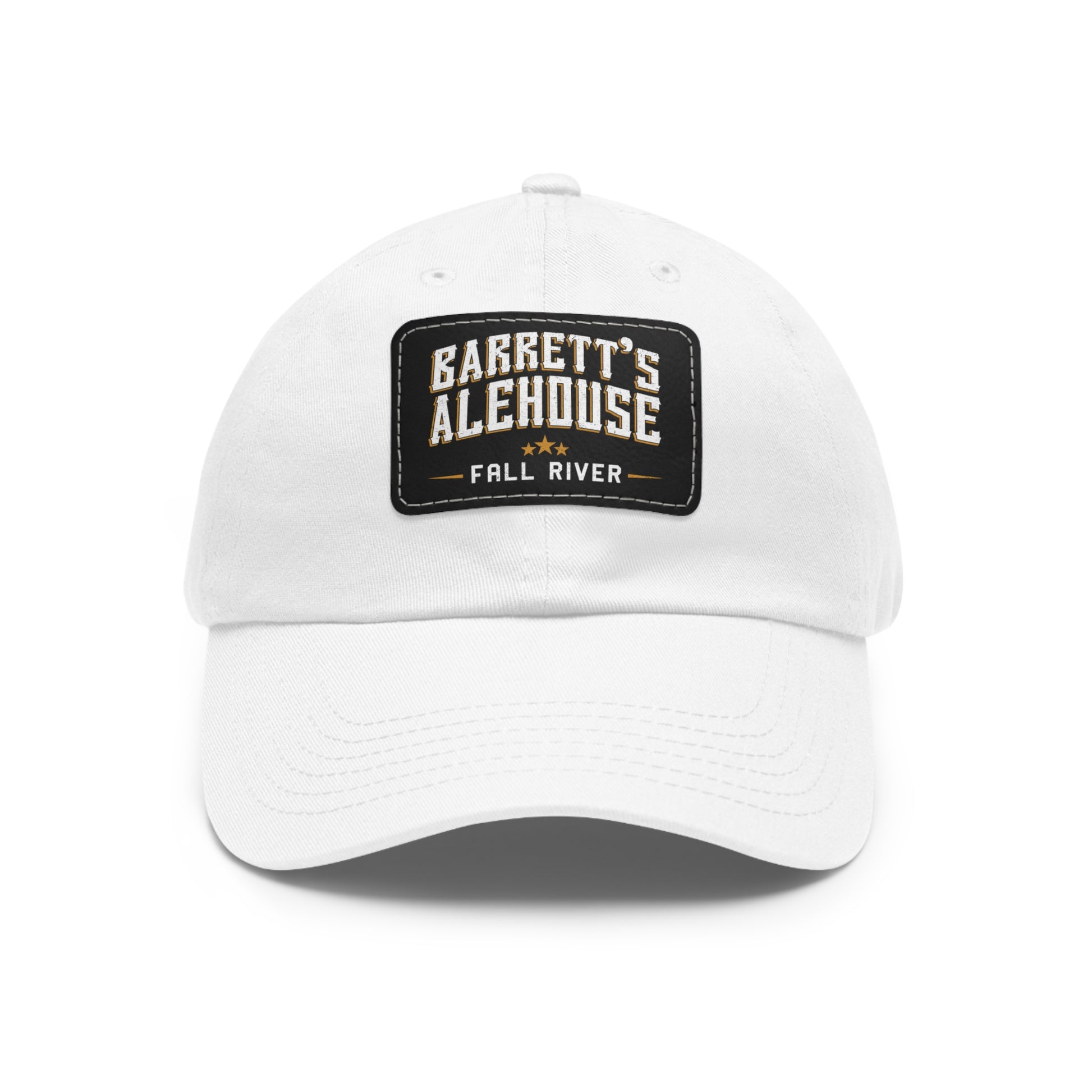 White unstructured dad hat with a black faux leather patch featuring the Barrett's Alehouse Fall River logo.