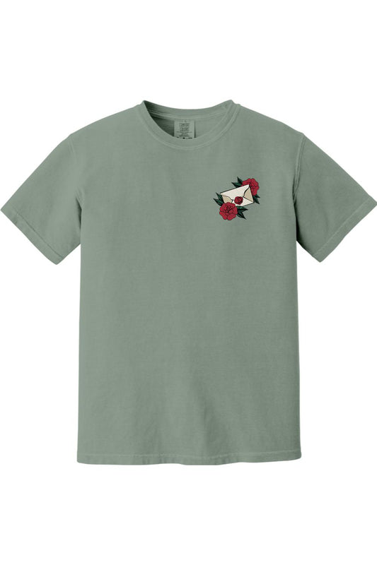 Sage green Comfort Colors ringspun cotton t-shirt featuring a small rose and envelope graphic on the chest.